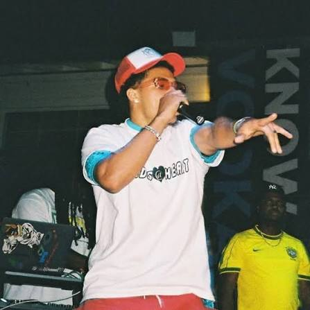 Deyton Jackson on stage in a Kids at Heart tee